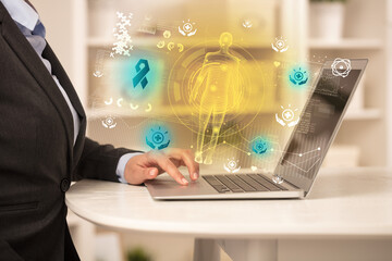 Doctor working on laptop with healthcare concept