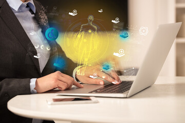 Fototapeta premium Doctor working on laptop with healthcare concept