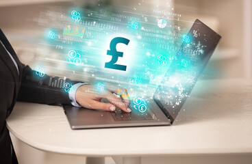 Young man watching stock market on laptop