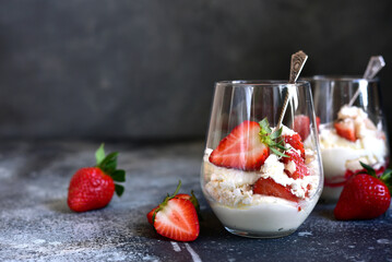 Traditional english dessert eton mess with meringue, whipped cream and fresh berries.