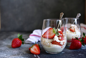 Traditional english dessert eton mess with meringue, whipped cream and fresh berries.
