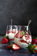 Traditional english dessert eton mess with meringue, whipped cream and fresh berries.