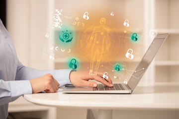 Doctor working on laptop with healthcare concept