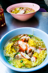 Rice noodle and dumplings with soup 