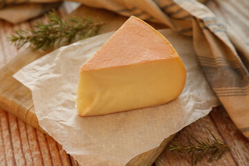 Portion of delicious Catalan cow's milk cheese (Spain) on rustic background