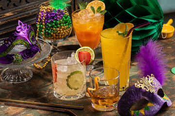 Alcoholic cocktails, Mardi Gras decoration on dark background - obrazy, fototapety, plakaty