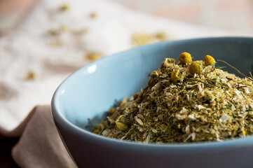 Round blue bowl with dried herb