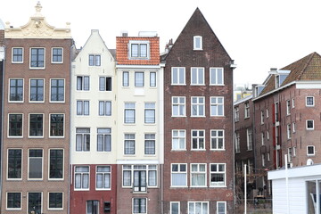 Fototapeta na wymiar Amsterdam Damrak Canal Traditional Building Facades, Netherlands