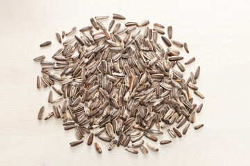 dry roasted sunflower seeds on white wooden background