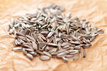 dry roasted sunflower seeds on brown paper background
