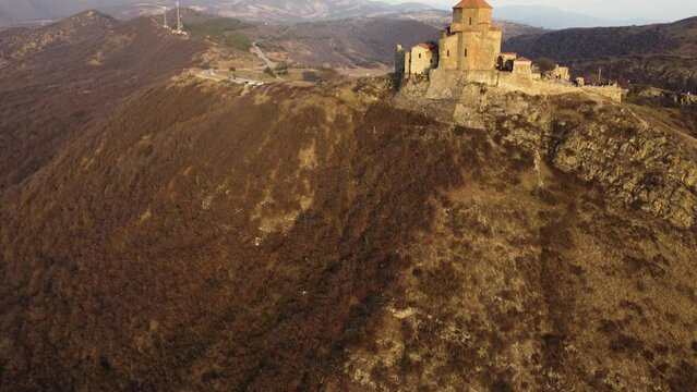 aerial view Jvari monastery in sunset 
It was built in 6 century 