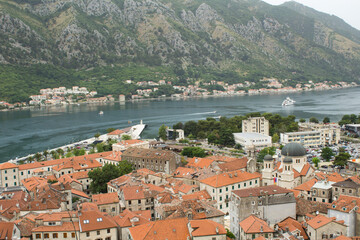 Naklejka na ściany i meble View of old city houses and embankment on a summer day. Kotor. Montenegro.