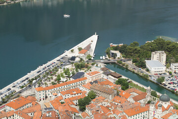 Top view of old city houses and embankment on a summer day. Kotor. Montenegro.