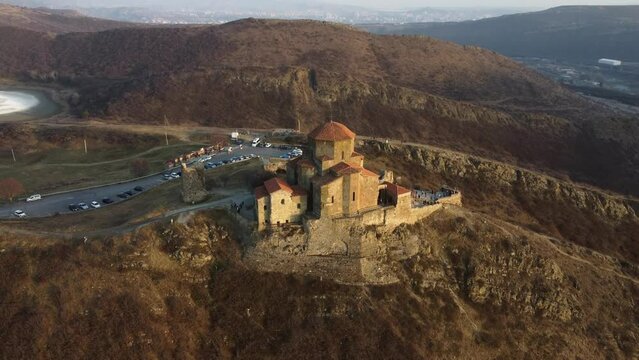 aerial view Jvari monastery in sunset 
It was built in 6 century 