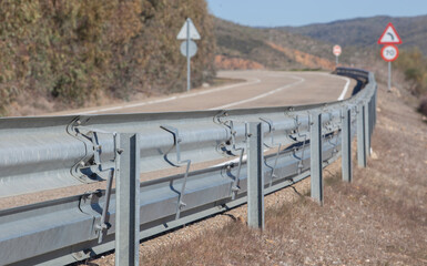 Guardrails poles covered flexible crash-absorber beam