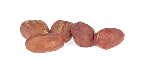 A pile of unpeeled peanuts close-up on a white. Isolated