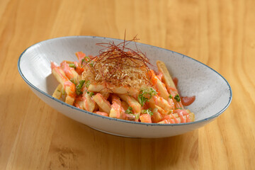 Japanese food deep-fried mentaiko fries in a bowl isolated on wooden table top view