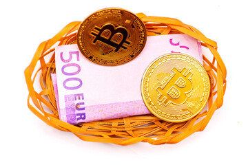 Bitcoin and euro banknote in a wicker basket.