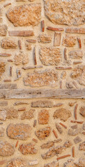 background, texture - rough masonry from wild stone and cement on a wooden frame