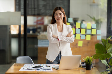 Beautiful Asian woman is a businesswoman who leads a new generation of startups, a woman who runs and manages a business plan to build confidence and stability in business, woman-led business concept.