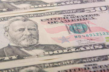 Obraz na płótnie Canvas Fragments close-up fragment of fifty dollar bills bundle.