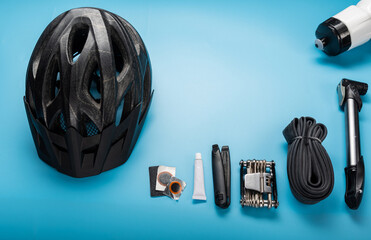 Minimal repair kit for a bike rider. Cycling helmet and bicycle repair parts. Velo composition....