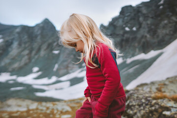 Naklejka premium Child hiking in mountains family travel vacations trip healthy lifestyle 3 years old kid girl outdoor camping adventure sustainable tourism