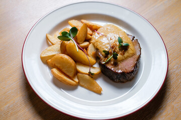 Steak with potatoes and sauce. Menu design concept for a restaurant.