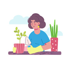 cute smiling woman with gardening tools is working in the garden, planting seedlings from a flower pot.