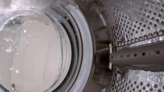 Washing machine is cleaning dirty laundry