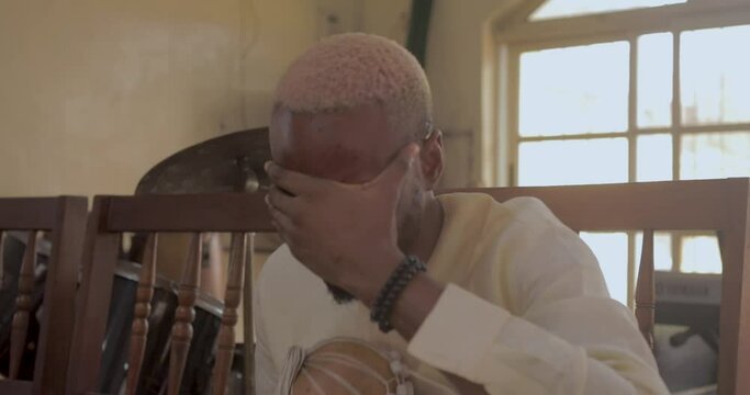 man crying in church