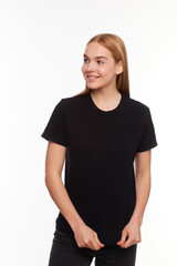 Fototapeta premium beautiful blond female posing with a blank black t-shirt. Ready for your design or artwork.