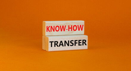 Know-how transfer symbol. Concept words Know-how transfer on wooden blocks on beautiful orange table orange background, copy space. Business, innovation and know-how transfer concept.