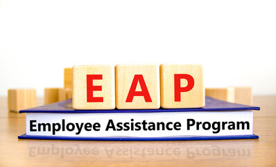 EAP employee assistance program symbol. Concept words EAP employee assistance program on cubes on...