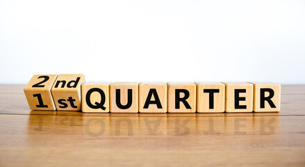 From 1st first to 2nd second quarter symbol. Turned wooden cubes and changed words 1st quarter to...