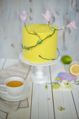 round yellow cake and a cup of tea. High quality photo