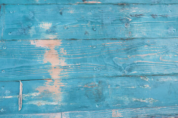 old wooden turquoise painted wall