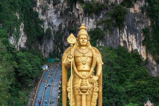 KUALA LUMPUR, MALAYSIA - DEC 2019: Murugan Statue (Tugu Dewa Murugga) in Batu Caves, Selangor, Kuala Lumpur. Tallest statue of a Hindu deity in Malaysia made with 300 liters of Gold Paint.