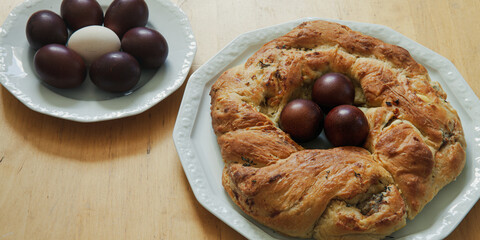 Savory cake in wreath shape. Traditional Easter stuffed baked bread and boiled eggs. Italian cuisine.
