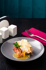 Poacheg egg with bacon on bread
