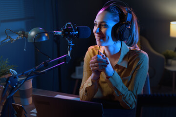 Young radio host broadcasting in the studio