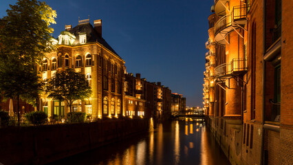 Fototapeta na wymiar Speicherstadt Hamburg buildings illuminated in the blue hour.