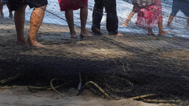 Artisanal collective fishing in Playa Hermosa in Mexico. Traditional or subsistence fishing consists of various small-scale, low-technology, low-capital, fishing practices undertaken by individuals