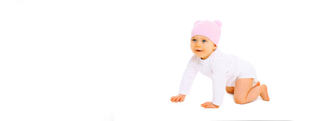 Happy cute little baby crawling in pink hat on the floor on white background, banner blank copy space for advertising text