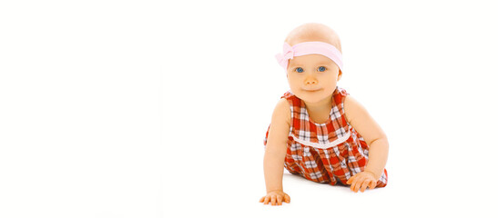 Portrait of cute little baby crawling and playing on floor on white background