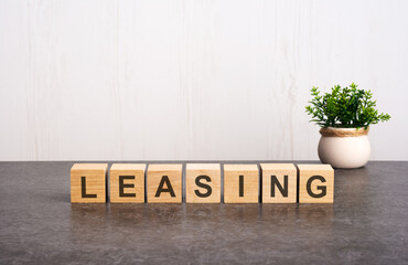 word LEASING made with wood building blocks - obrazy, fototapety, plakaty