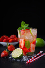 Strawberry mojito. Refreshing summer drink with berries, lime and mint