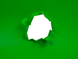 Green torn paper hole damaged frame isolated background for text