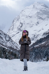 Girl walking in the snowy forest.