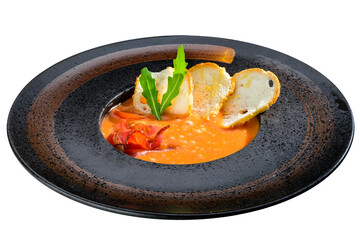 Delicious pumpkin and carrot soup with tomatoes and meat, served